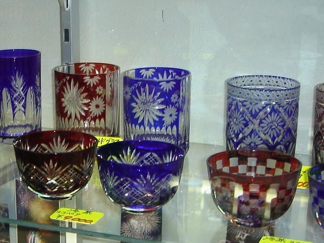 Red, blue and clear Edo kiriko cut-glass cups displayed in Tokyo